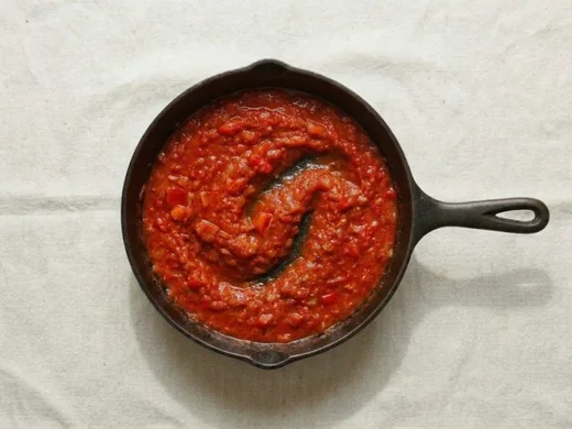 Tomato sauce simmering in the skillet